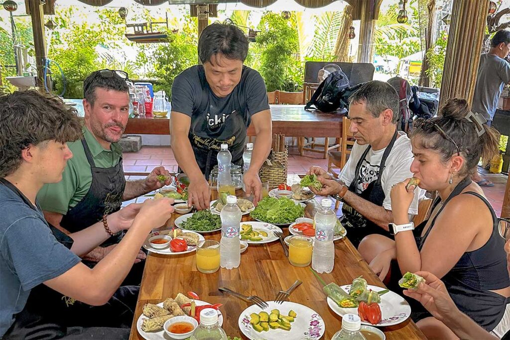 Guests enjoying a meal after their Coconut Fragrance Cooking Class in Hoi An