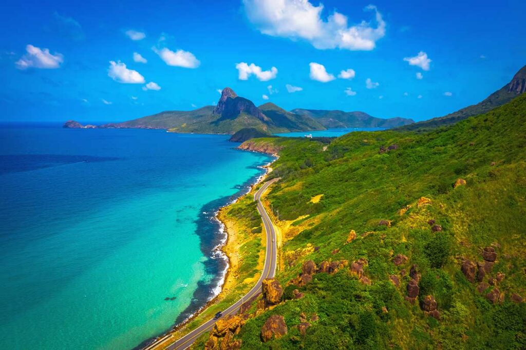 An aerial view of Con Dao Island with the road along the coastline.