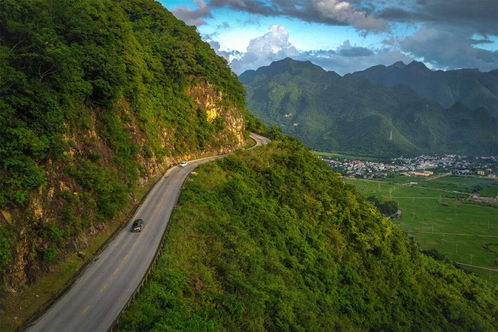 Steep section of the Thung Khe Pass with Mai Chay valley on the background seen from drone