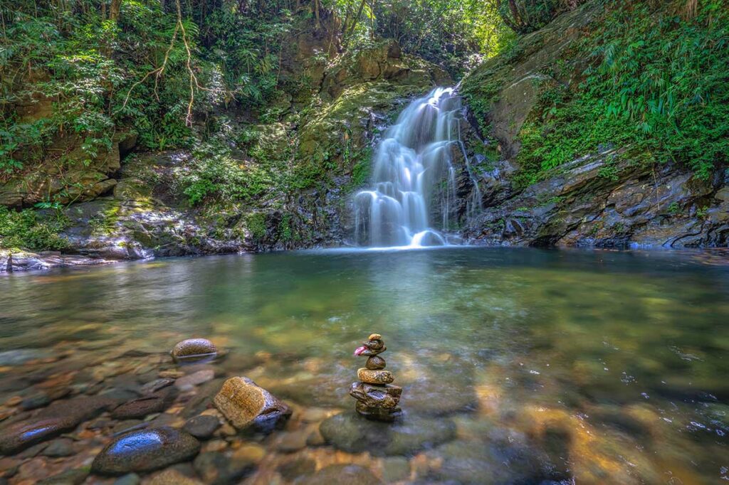 A small lake (natural pool) with a small waterfall - part of the five lake trail inside Bach Ma National Park