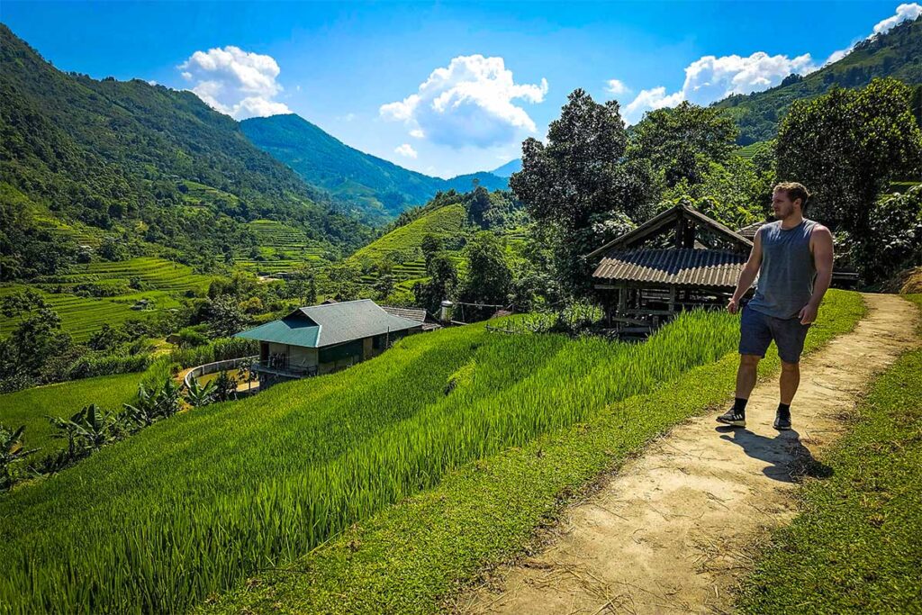 A tourist doing a Hoang Su Phi trekking tour through the terraced rice fields