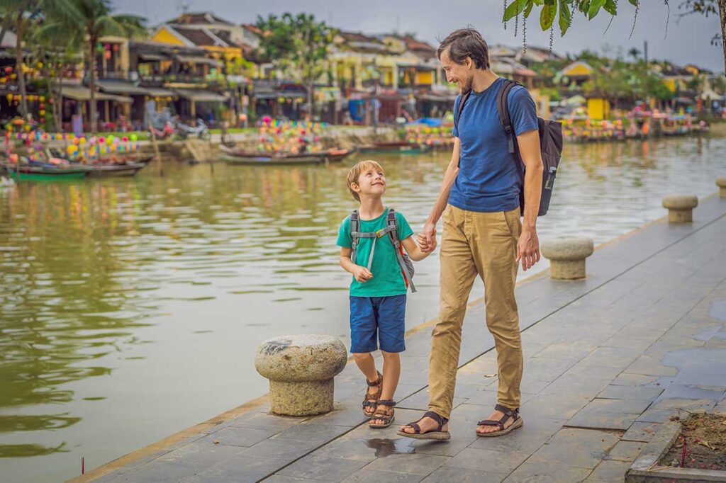 Hoi An with kids – father and son exploring the lantern-lit streets and riverside of the Ancient Town together