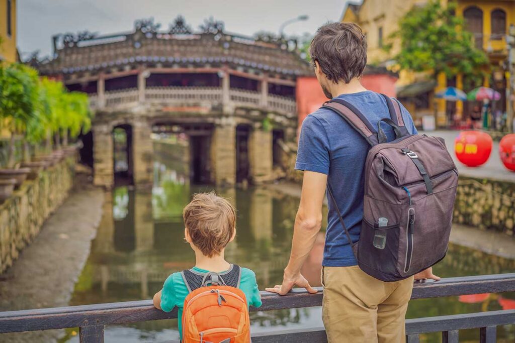Hoi An with kids – father and son visiting the Japanese Covered Bridge in Hoi An Ancient Town
