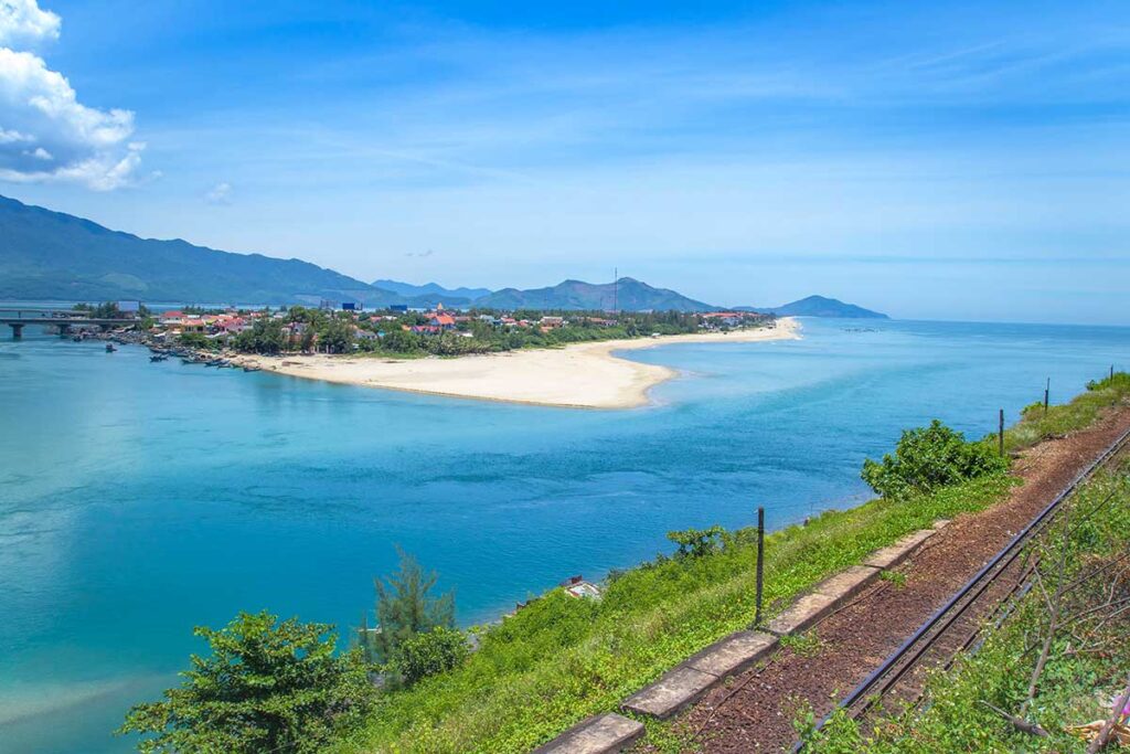 Nearby a train track that runs along Hai Van Pass and in the distance you see Lang Co Beach seen from the road of Hai Van Pass