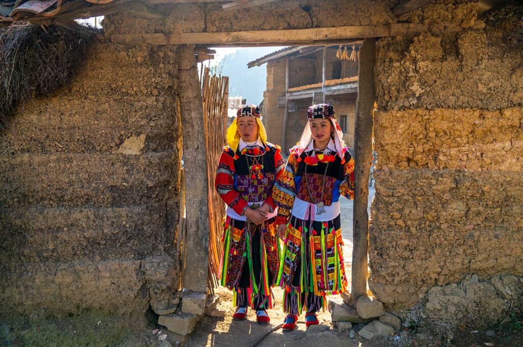 Two very colorful ethnic people from the Lo Lo ethnic group in Lo Lo Chai Village near Lung Cu in Ha Giang