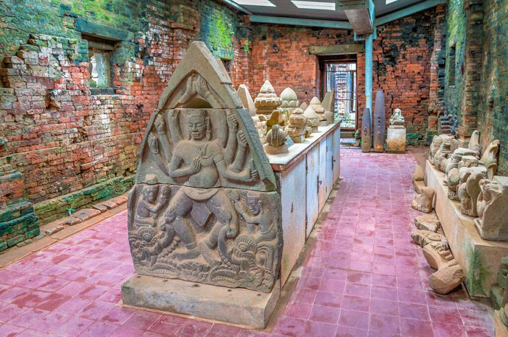 Stone reliefs and sculptures inside Group A museum at My Son Sanctuary, preserving Hindu art from the Champa Kingdom