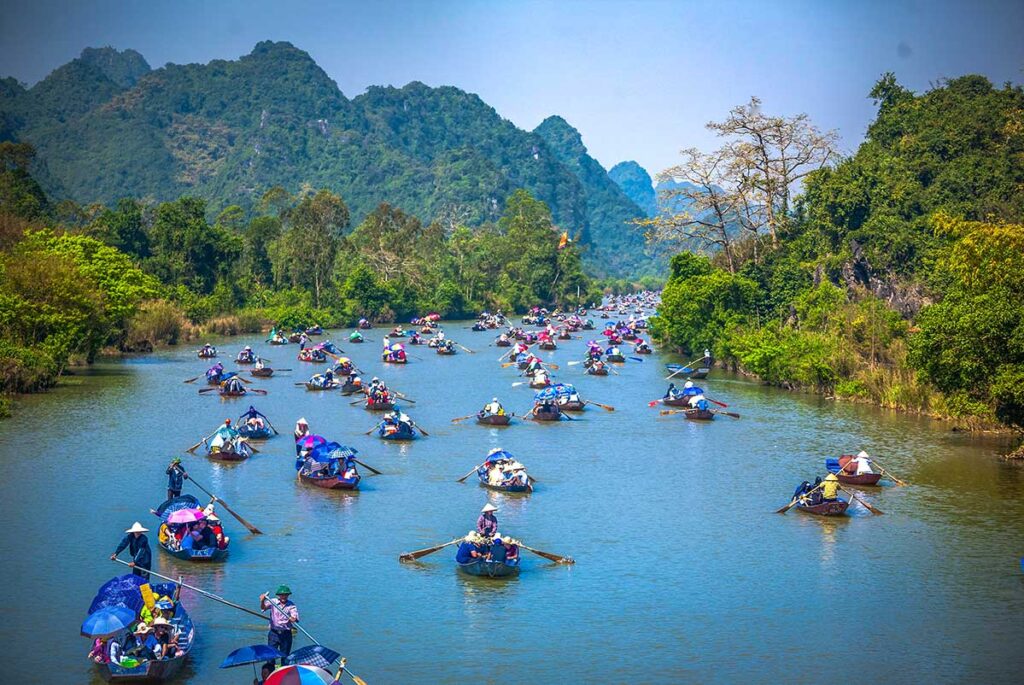 Many rowing boats on the Yen Stream during Perfume Pagoda Festival