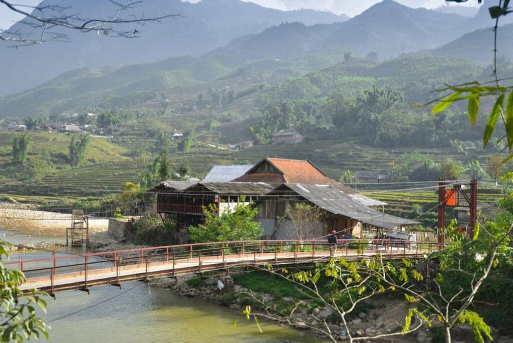 A bridge crossing the river into Su Phan Village near Sapa