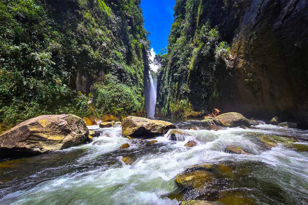 a gorge near Sapa, with in the background the Dragon Waterfall