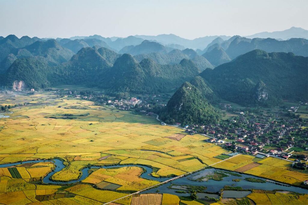 The view from Bac Son Valley Viewpoint - A valley fill with rice fields, a few small villages and a river running through it