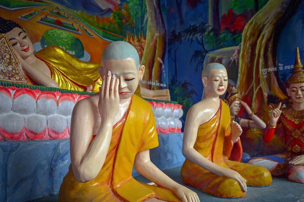 Colorful interior statues of monks and deities at Xa Xia Khmer Temple in Ha Tien, Vietnam.