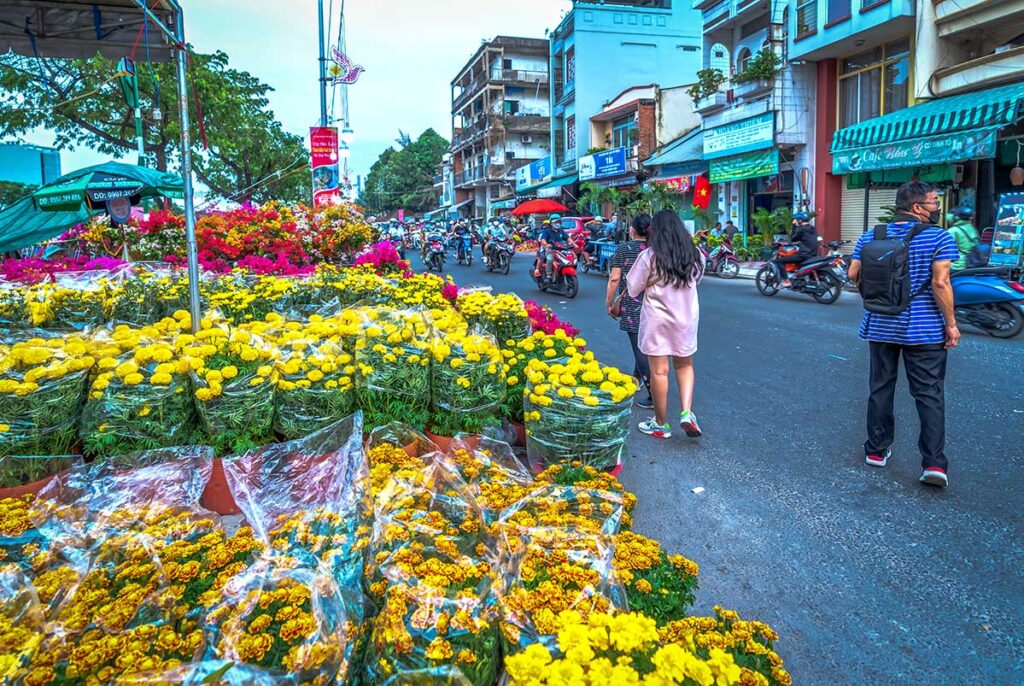 Yellow flowers being sold on the street in Vietnam for Vietnamese New Year Tet