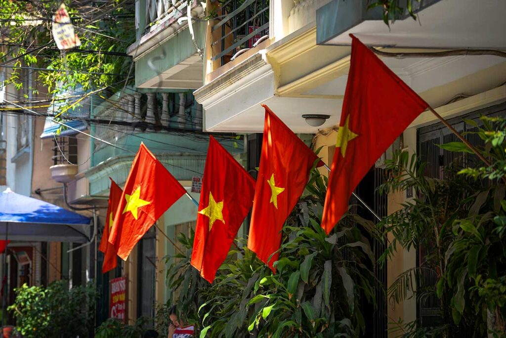 Vietnamese flags hanging outside houses during celebrations of independence at Vietnam National Day