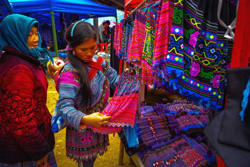 minority woman shopping clothes at Can Cau Market