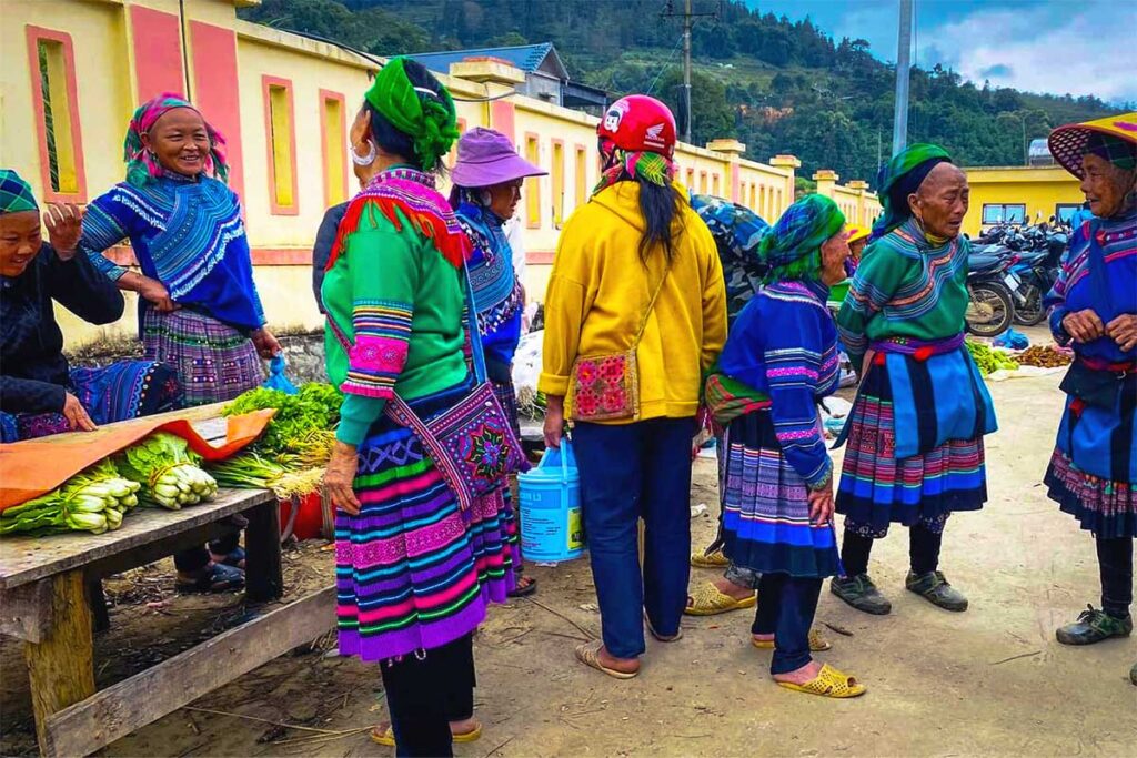 colorful ethnic woman socializing at the Sin Cheng Market