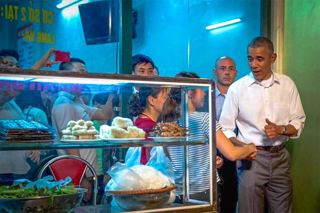 Obama and Bourdain at Bun Cha Huong Lien: Former President Obama shares a laugh with the staff of Bun Cha Huong Lien, a local Hanoi restaurant made famous by Anthony Bourdain.