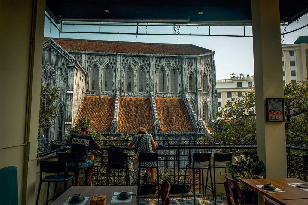 St. Joseph's Cathedral View from Cafe: Side view of St. Joseph's Cathedral in Hanoi, seen from a nearby cafe on a higher floor. (St. Joseph’s Cathedral)