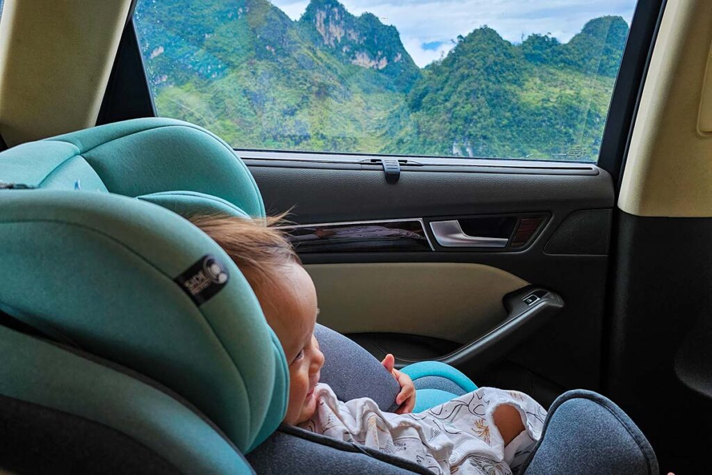 a baby traveling by car in Ha Giang