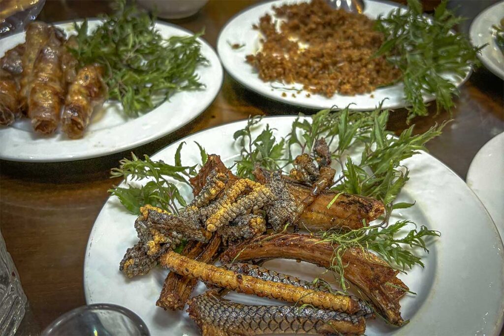 A sizzling platter of Grilled Snake, a traditional dish at Hung Ha Noi Snake Restaurant in Le Mat Village.