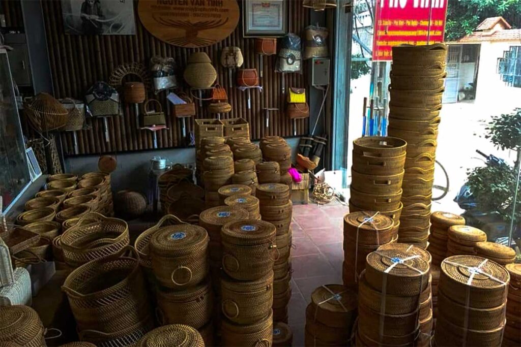 A quaint shop in Phu Vinh Bamboo Village showcases a variety of beautiful bamboo baskets for sale.