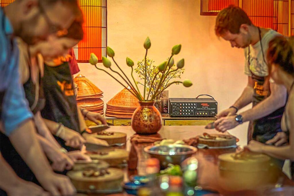 Rose Kitchen Cooking Class: Tourists learn to prepare Vietnamese dishes in a hands-on cooking class at Rose Kitchen in Hanoi. (unique dining in Hanoi)