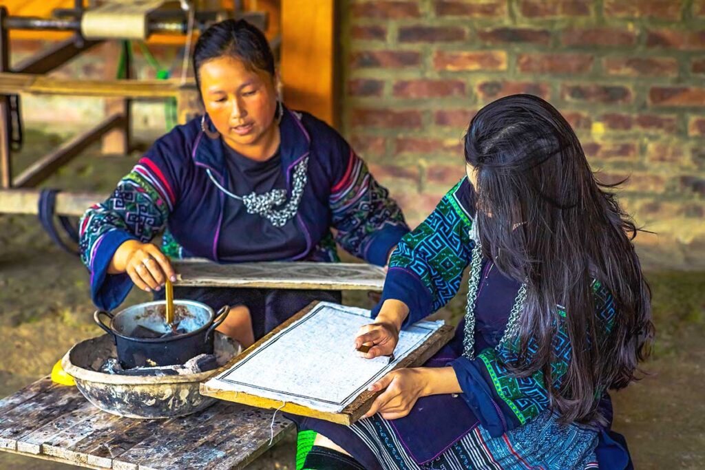 minority woman making hand woven fabric using hemp