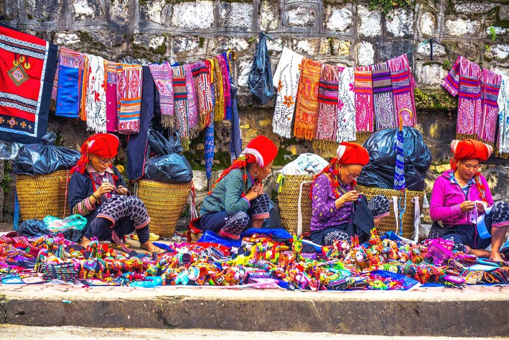 Sapa minority woman selling souvenirs and hand made products