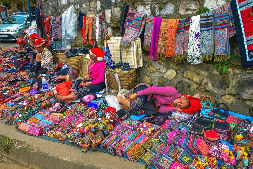 ethnic minority woman selling souvenirs on the street of Sapa