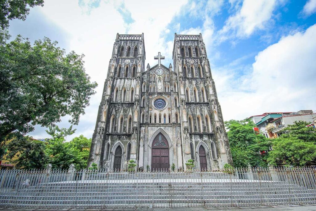 St. Joseph's Cathedral Facade: The neo-Gothic facade of St. Joseph's Cathedral in Hanoi, an architectural landmark and popular tourist attraction.