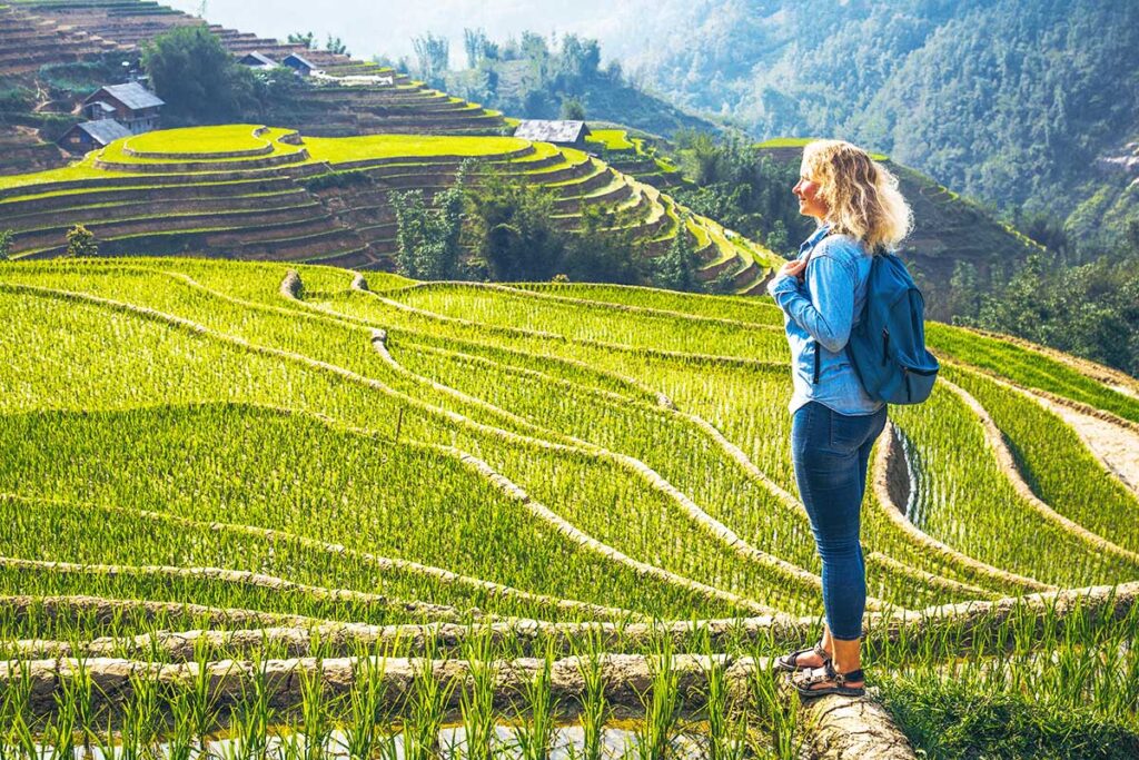 foreign woman making a trekking in Sapa through Muong Hoa Valley