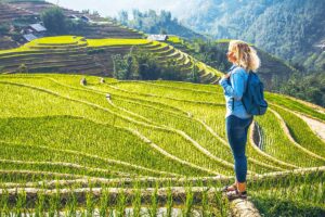 foreign woman making a trekking in Sapa through Muong Hoa Valley