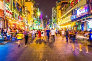 Vibrant Bui Vien Street in Vietnam, filled with backpackers and bustling bars.