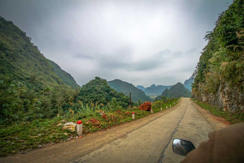 Driving a motorbike through Bac Son Valley in Lang Son Province