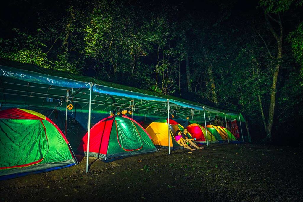 Hang Va Cave expedition campsite with tents in the middle of the jungle of Phong Nha National Park