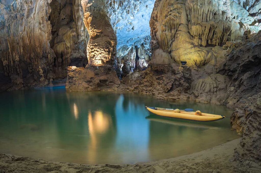 Kayaking on a underground river inside Phong Nha Cave - Part of Phong Nha National Park - Vietnam