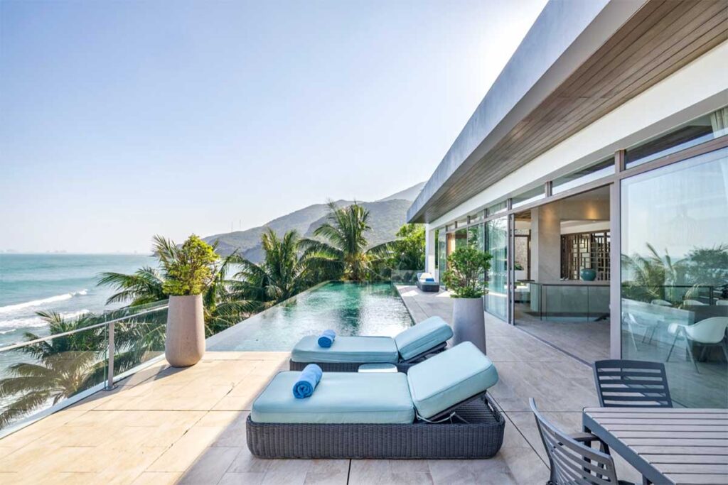 Mia Luxury Resort in Nha Trang with a pool deck overlooking the beach