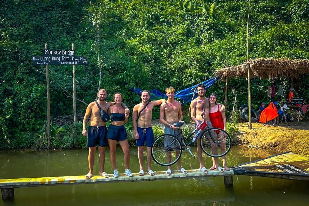 A few tourists standing on the Monkey Bridge at Cuong Rung Farm in Phong Nha