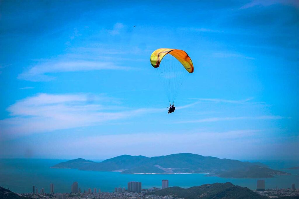 A paragliding flight near Nha Trang with the city and coast in the background