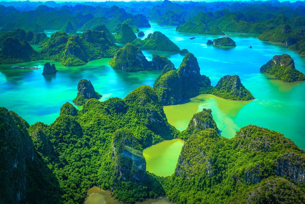 Stunning views over karst islands and rocks from a sightseeing flight by sea plane in Halong Bay