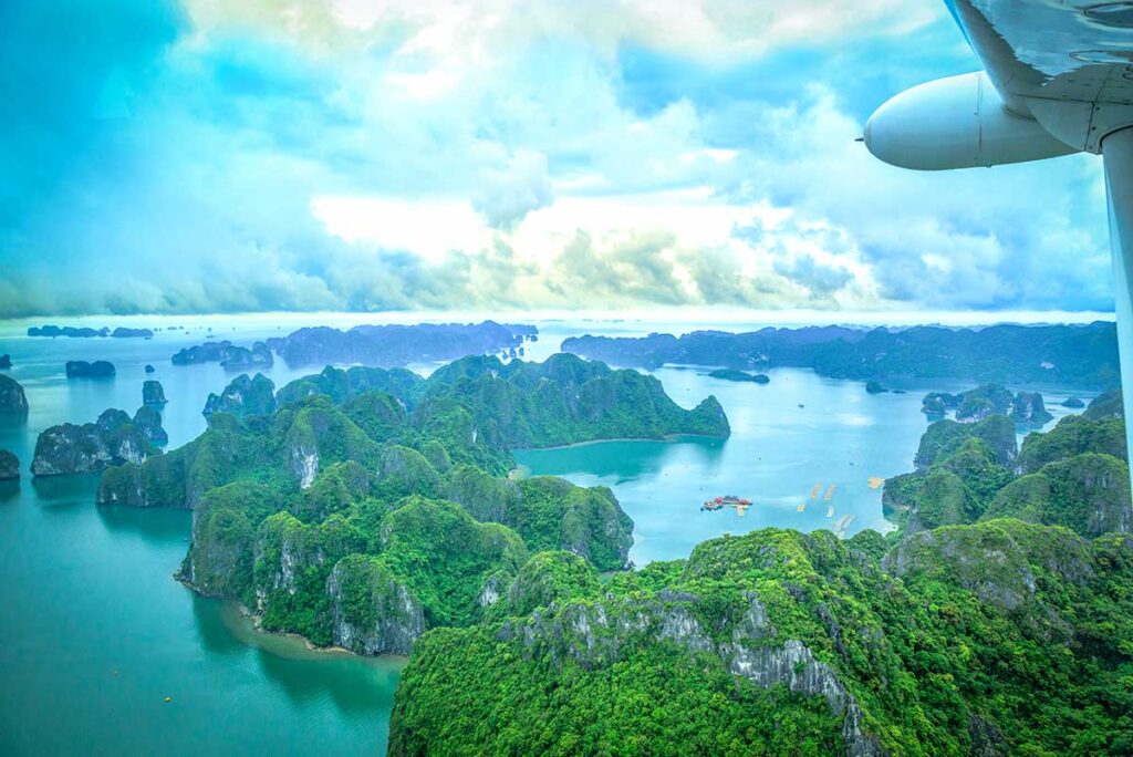 Stunning views over karst islands and rocks from a sightseeing flight by sea plane in Halong Bay