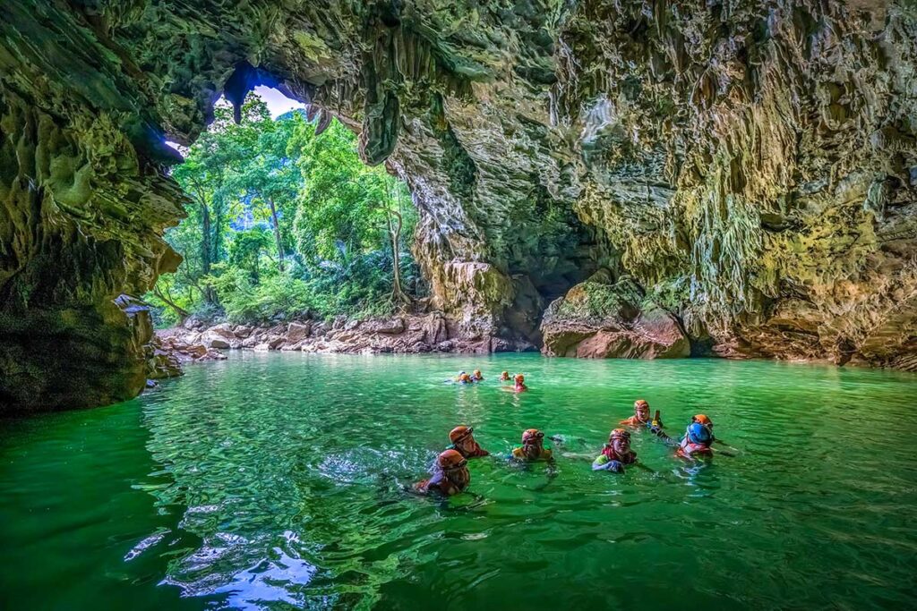 Swimming inside Tu Lan Cave