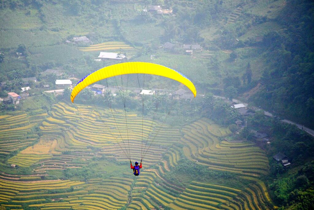 Paragliding over the terraced rice fields at Mu Cang Chai