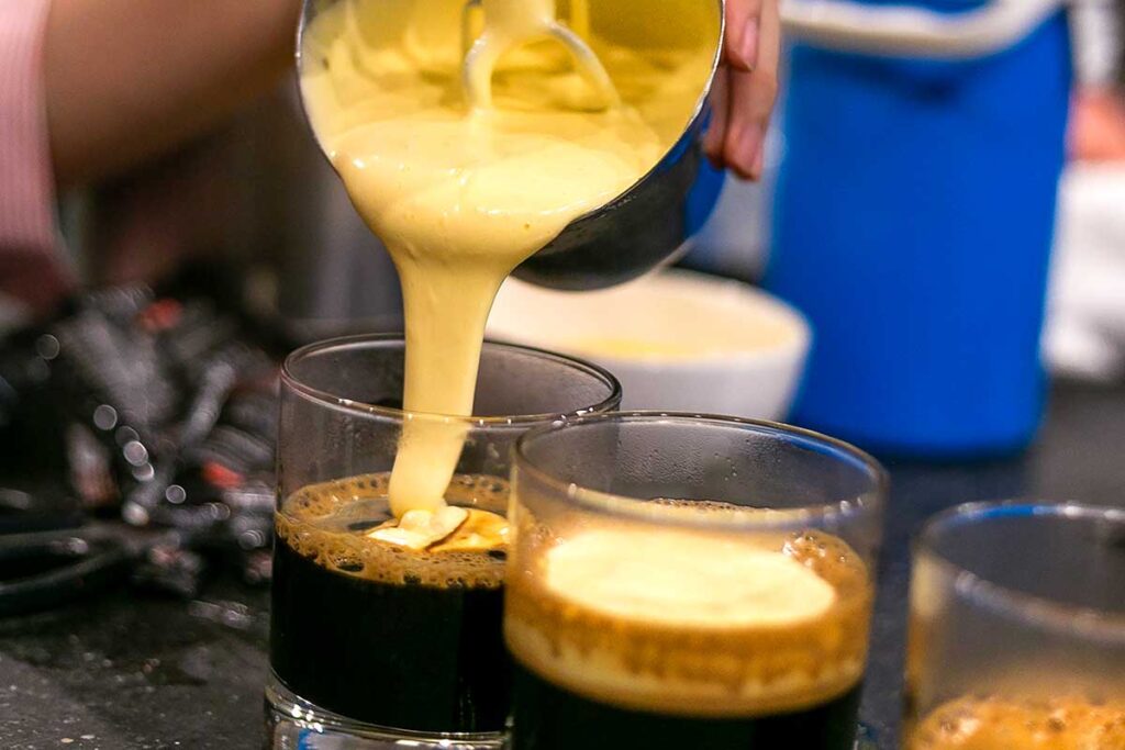 Egg cream poured on top of a coffee to make Vietnamese Egg Coffee