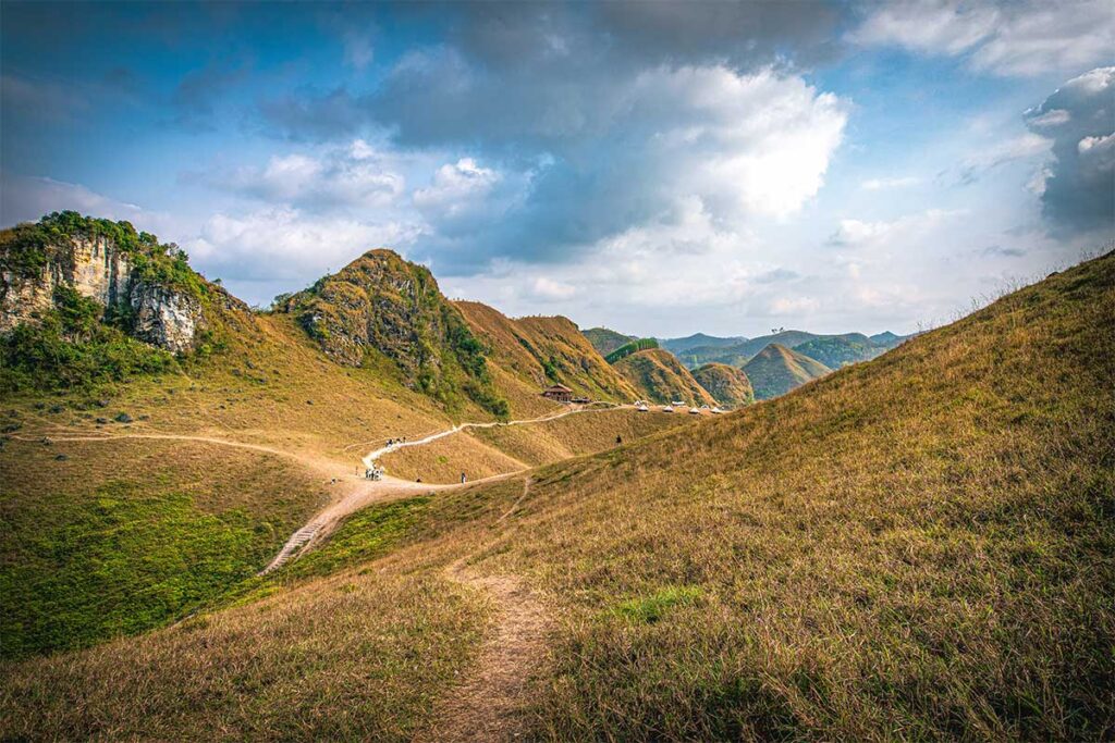 A view of the yellow burned looking grass mountains in Cao Bang of Vinh Quy Grass Hill, during dry season, the best time to visit this area