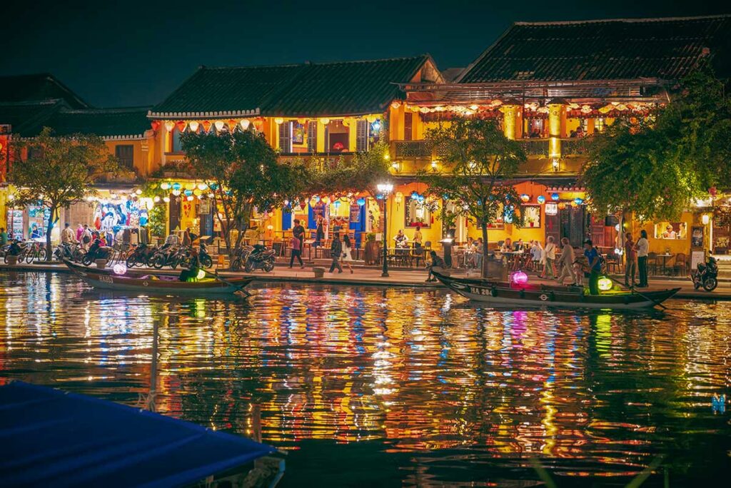 Lantern-lit riverside cafés in Hoi An Ancient Town at night – one of the best things to do in Hoi An after dark.