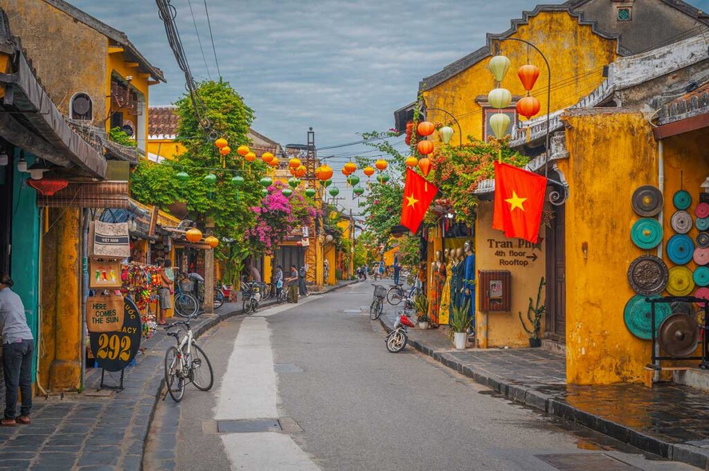 Yellow heritage houses and lanterns along the streets of Hoi An Ancient Town – a must-do walking experience in Vietnam.