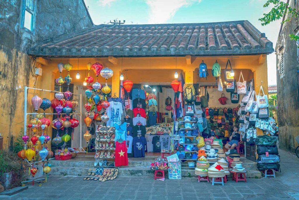 Colorful lanterns, bags, and souvenirs for sale in Hoi An Ancient Town – great place for local shopping and gifts.
