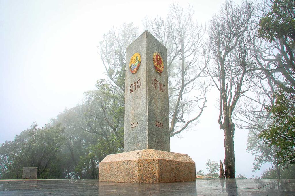 ​Milestone marker indicating the convergence of Vietnam, Laos, and China at A Pa Chai.