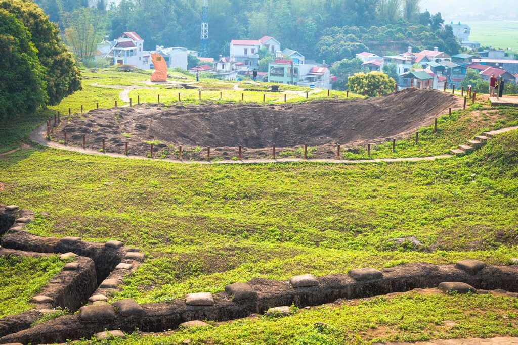 ​A massive bomb crater on Hill A1, a testament to the intense battles fought during the Dien Bien Phu campaign.