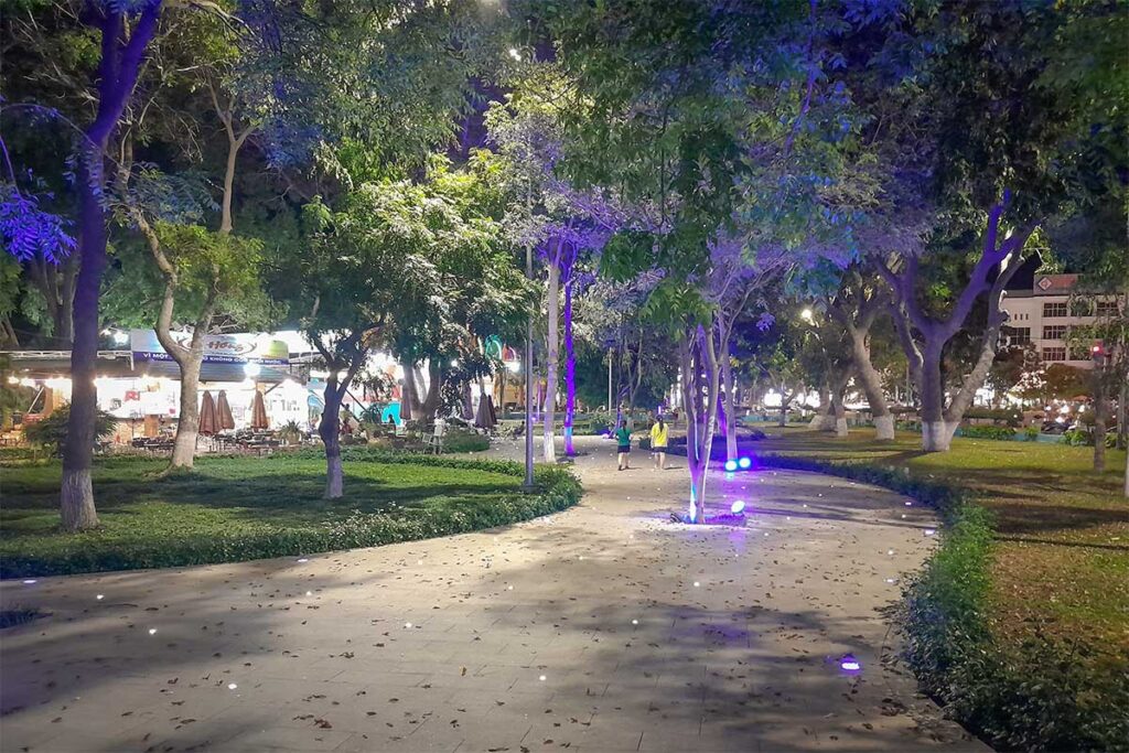 April 16th Park in Phan Rang at night, with tree-lined paths, soft lighting, and locals out for an evening walk.